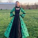 This dress is really great for what you're paying! It looks great and has lasted through several events so far. It's lightweight and ready to put on, and I was very happy with the look! Be aware that you'll need a crinoline skirt or something similar to get the pouf in the skirt. There's also a zipper on the side so that you can get it on and off. Be carful to not pull too hard on the lacing on the back as the loops aren't particularly strong (I accidentally sat on the end of mine and had to fix the loops I ripped)